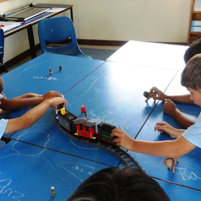 Children playing with a train set