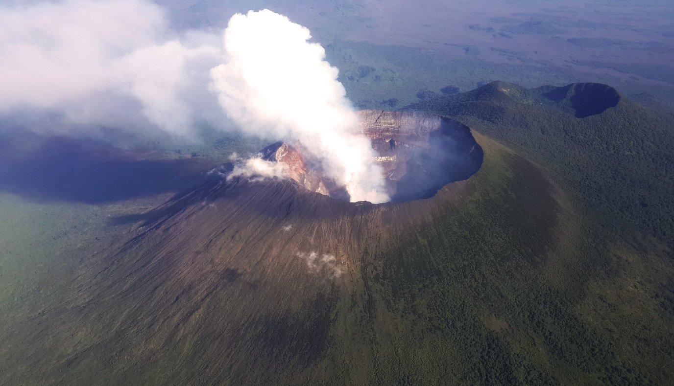 An_aerial_view_of_the_towering_volcanic_peak_of_Mt._Nyiragon.jpg